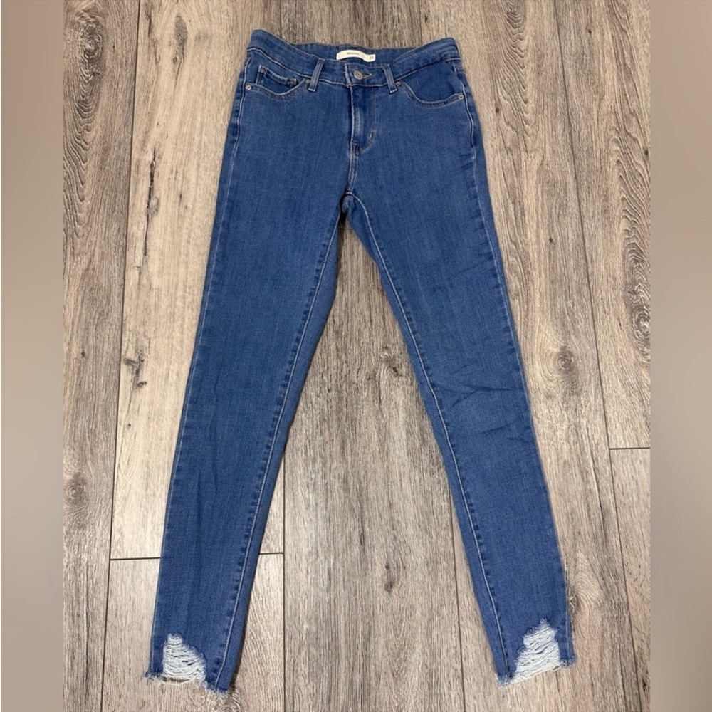 Levi’s: 711 Mid Rise Skinny Denim Jeans. Distressed Bottoms. Size 25